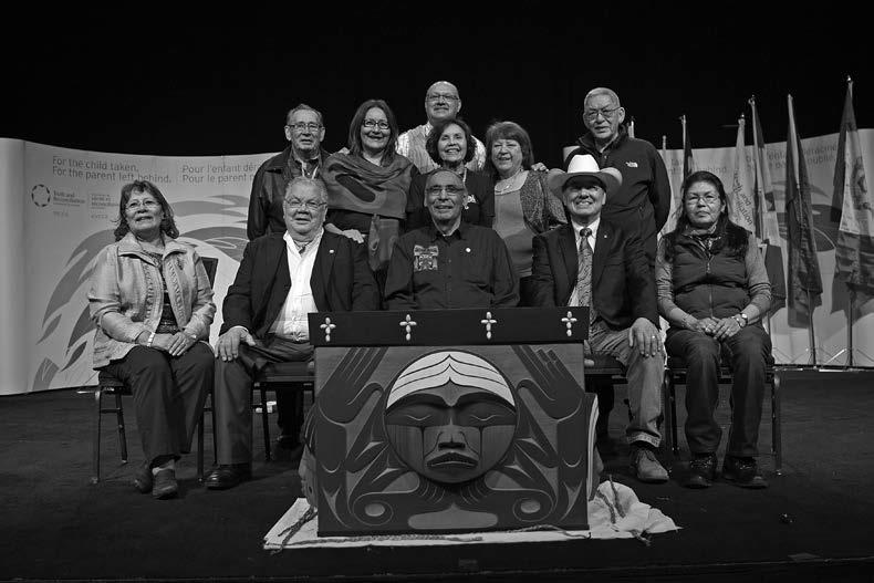 The Indian Residential School Survivor Committee. Left to right, starting in the back: John Morrisseau, Terri Brown, Eugene Arcand, Doris Young, Lottie May Johnson, John Banksland. Seated: Rebekah Uqi Williams, Barney Williams, Gordon Williams, Commissioner Chief Wilton Littlechild, Madeleine Basile.