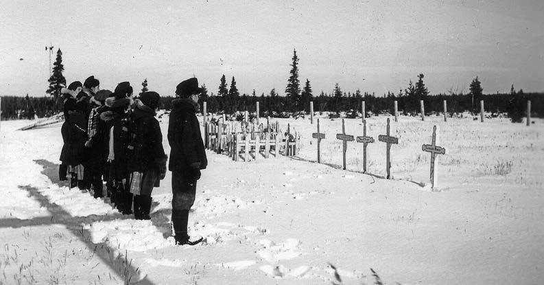 Residential school students at the Roman Catholic cemetery in Fort George, Québec. Deschâtelets Archives.
